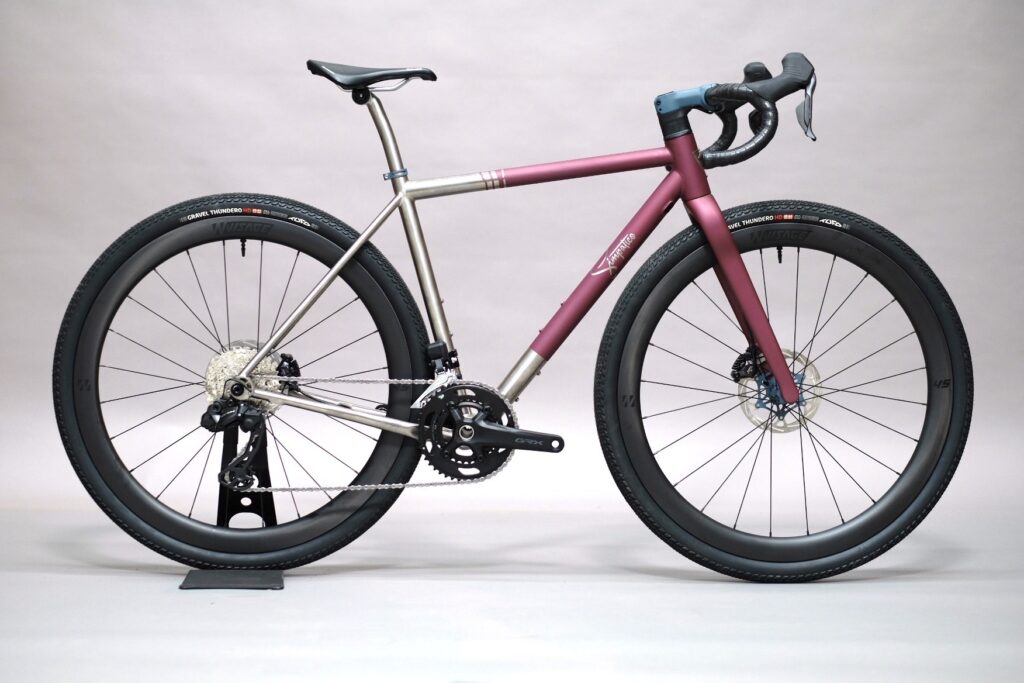 High-performance gravel bike with lightweight frame and durable tyres for versatile riding.